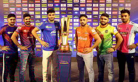 The six captains pose with the PKL trophy