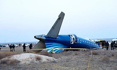 A part of Azerbaijan Airlines' Embraer 190 lies on the ground near the airport of Aktau, Kazakhstan (AP)