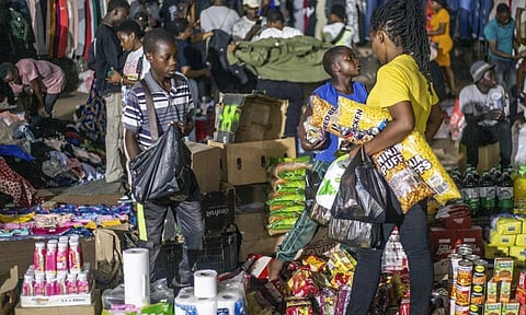 Zimbabwe’s new currency woes hit traditional stores while illegal night bazaars flourish