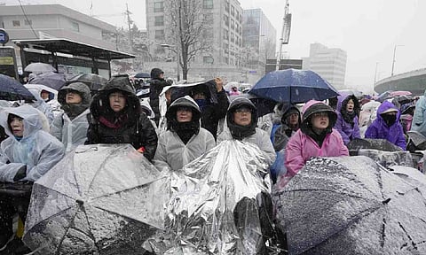 Supporters of impeached South Korean President Yoon Suk Yeol attend a Sunday service as they gather to oppose his impeachment near the presidential residence in Seoul, South Korea (AP)
