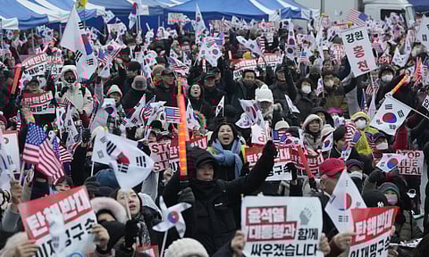 Supporters of impeached South Korean President Yoon Suk Yeol attend a rally to oppose his impeachment near the presidential residence in Seoul (AP)