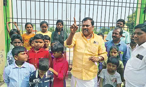 Ward Councillor T Sathyanathan protests along with kids