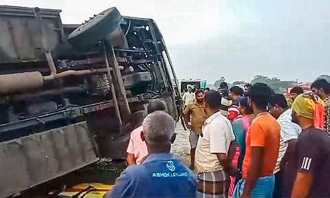 People gather near an overturned bus after an accident, in Tirunelveli district, Tamil Nadu, Wednesday, Jan. 8, 2025. (PTI Photo)