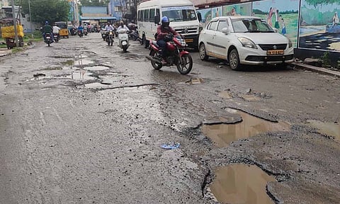 One of the many pothole-riddled roads in Perungalathur and Peerkankaranai