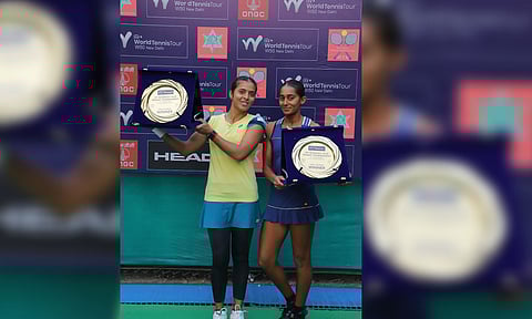 Ankita Raina and Naiktha Bains with the trophy