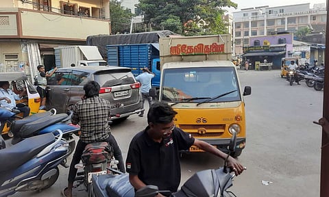 Vehicles parked haphazardly on VV Kovil Street in Choolai