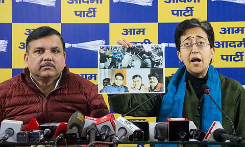 Delhi Chief Minister and AAP leader Atishi with party leader Sanjay Singh addresses a press conference (PTI)