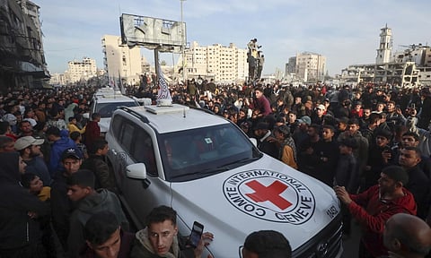 A Red Cross convoy arrives to collect Israeli hostages released after a ceasefire agreement between Israel and Hamas took effect, in Gaza City (AP)