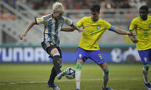 Argentina's lan Subiabre, left, battles for the ball against Brazil's Vitor Reis during their FIFA U-17 World Cup quarterfinal soccer match at Jakarta international Stadium in Jakarta (AP)