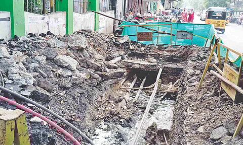 Open pit outside the park poses a safety risk for pedestrians and makes navigation a challenge 