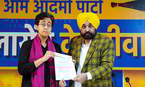 Delhi Chief Minister Atishi and her Punjab counterpart Bhagwant Mann address a press conference, in New Delhi (PTI) 