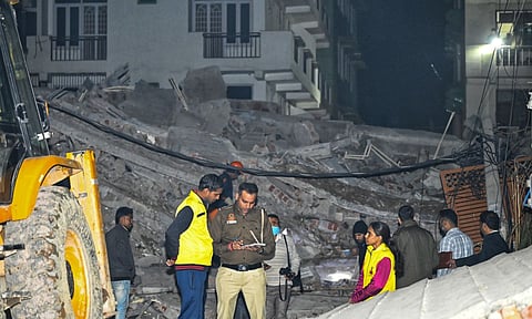 Police at the site of the building collapse in Burari area of New Delhi (PTI)