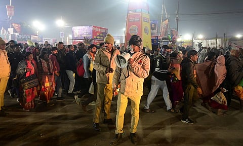 Police personnel manage crowds during the ongoing 'Maha Kumbh Mela' festival on 'Mauni Amavasya', in Prayagraj, Wednesday, Jan. 29, 2025 (PTI) 