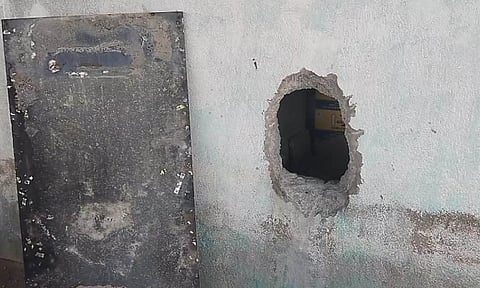 Damaged wall at TASMAC shop following burglary attempt