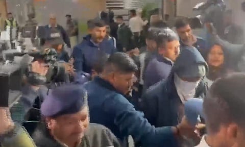 Ahmedabad: Security personnel escort a Gujarat native deported from US after he was brought to the Ahmedabad airport, Thursday, Feb. 6, 2025. A US military plane brought 104 deported Indians to Amritsar on Wednesday. (PTI photo)