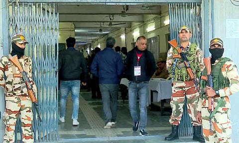 Security personnel stand guard outside a counting centre for Delhi Assembly polls (PTI)