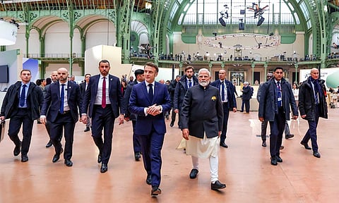 Prime Minister Narendra Modi with French President Emmanuel Macron and other world leaders, and global tech experts poses for group picture during the AI Action Summit, in Paris (PTI) 