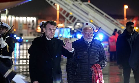 French President Emanuel, left, and Indian's Prime Minister Narendra Modi arrive at Marseille Provence airport in Marignane, southern France (PTI)