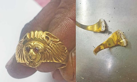 A ring presented as gold shows white metal inside