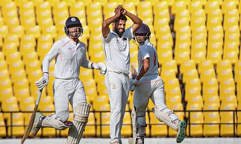 Vidarbha's Danish Malewar and Yash Rathod run between the wickets on the first day