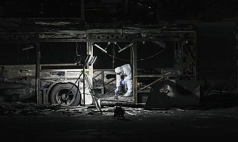 A Israel police officer inspects the scene (AP) 