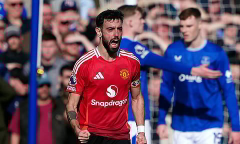 Manchester United's Bruno Fernandes celebrates scoring his side's first goal during the English Premier League match against Everton at Goodison Park (AP)