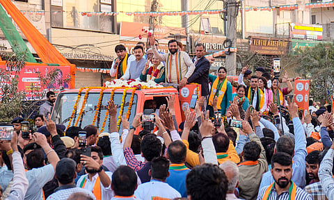 Haryana Chief Minister Nayab Saini campaigns for BJP mayoral candidate Rajrani Malhotra during a roadshow ahead of the Municipal Corporation Gurugram Mayor elections, in Gurugram (PTI)