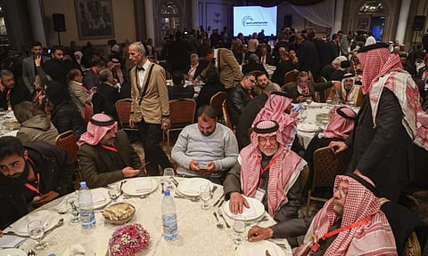 Participants in Syria’s national dialogue conference gather at the Dama Rose hotel in Damascus (AP)