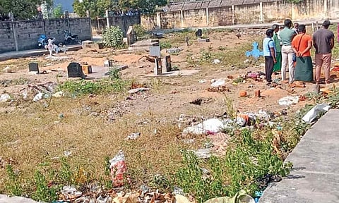 Trash strewn everywhere on the burial ground where family members conduct last rites of a loved one
