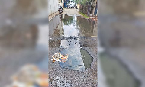 Sewage overflows on a road at Bharathi Nagar