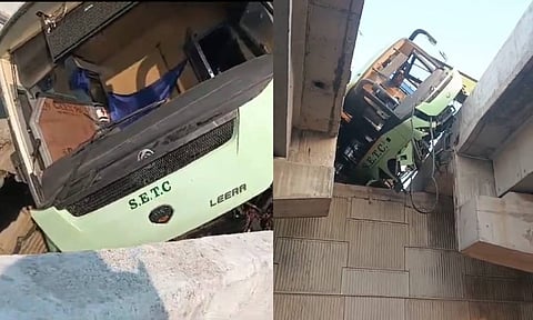 Government bus hanging off 40-feet above ground after crash
