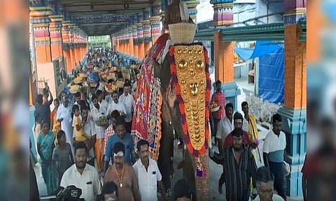 Devotees outside Arulmigu Mariamman Temple to celebrate Poochorithal Festival (ANI) 