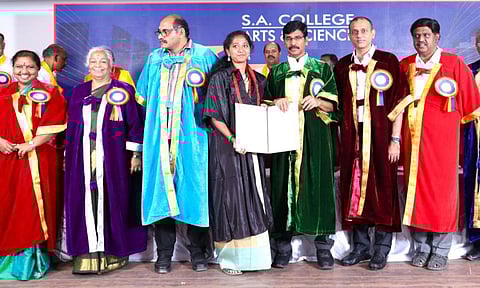 Former Chief Secretary Dr Irai Anbu handing over certificate to a student at the second graduation ceremony of Thiruverkadu SA Arts and Science College. Also seen are College Director Dr V Sayi Satyavathi, Principal Dr Malathi Selvakkumar, Joint Secretary of the Trust S Gopinath, Correspondent P Venkatesh Raja, SA Engineering College Director T Sabari Nath, SA Engineering College Advisor Salivahanan, and SA Engineering College Principal Dr S Ramachandran