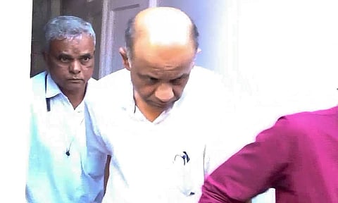 Hitesh Mehta, General Manager and Head of Accounts at New India Cooperative Bank, being taken by the EOW officers after a court granted him a 5-day custody (PTI)