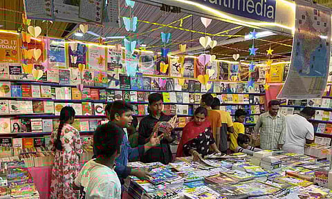 Visitors going through the titles on display at the book fair under way at the exhibition grounds on CV Naidu Salai