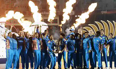 Mumbai Indians' players celebrate with the trophy after winning the Women's Premier League (WPL) 2025 final (PTI)