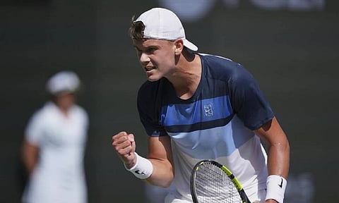 Holger Rune, of Denmark, celebrates a point against Daniil Medvedev, of Russia, during their semifinals match at the BNP Paribas Open tennis tournament Saturday (AP)