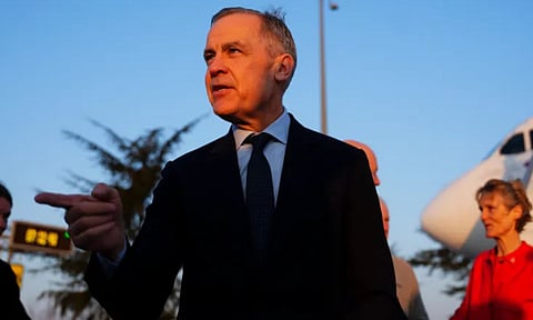 Canada’s Prime Minister Mark Carney arrives in Paris ( AP)