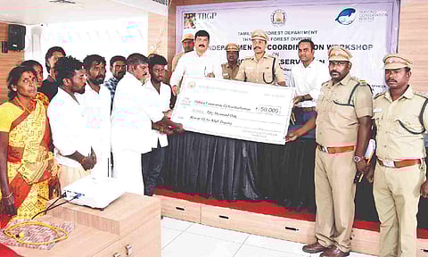 Cash reward being handed over to fishermen for Dugong conservation at Thanjavur on Thursday