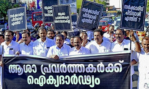 Leader of Opposition V.D. Satheesan (fourth from right) and other UDF MLAs take part in a protest march in support of ASHA workers, in Thiruvananthapuram on Thursday (PTI)
