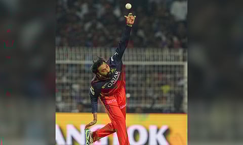 Royal Challengers Bengaluru's Krunal Pandya bowls during the Indian Premier League cricket match between Kolkata Knight Riders and Royal Challengers Bengaluru (PTI)