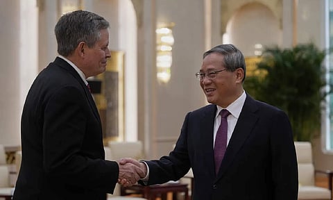 Chinese Premier Li Qiang and US Senator Steve Daines (AP)