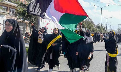 Shia Muslim women take part in a procession to show solidarity with Palestine on International Quds Day, at Magam area (PTI)