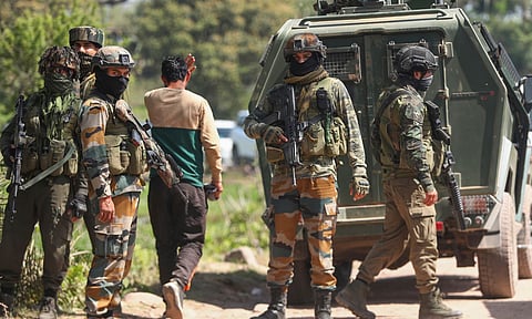 A security personnel keeps vigil during a fresh encounter with terrorists, in the Panjtirthi Jathana area of Kathua district (PTI)
