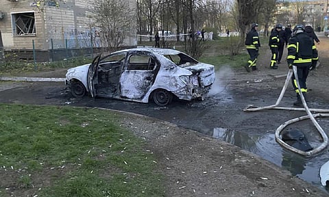 Rescue workers on a site after Russian rocket strike on residential neighbourhood killing civilians including children, in Kryvyi Rih, Ukraine (AP)