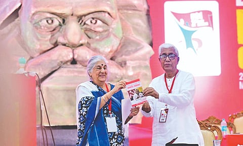 Former Tripura CM Manik Sarkar releasing a book on Sitaram Yechury at CPM party Congress