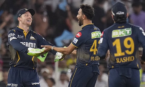 Gujarat Titans' Prasidh Krishna celebrates with Jos Buttler after taking the wicket of Rajasthan Royals' captain Sanju Samson during an Indian Premier League (IPL) 2025 T20 cricket match between Gujarat Titans and Rajasthan Royals, at the Narendra Modi Stadium, in Ahmedabad (PTI) 