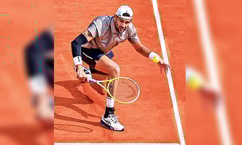 Matteo Berrettini returns a shot during the match