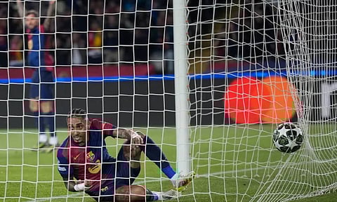 Barcelona’s Raphinha scores his side’s opening goal during the Champions League quarterfinal first leg soccer match between Barcelona and Borussia Dortmund (AP)