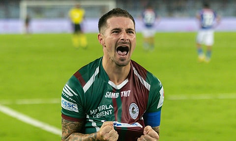 Jamie Maclaren celebrates after scoring the winner 